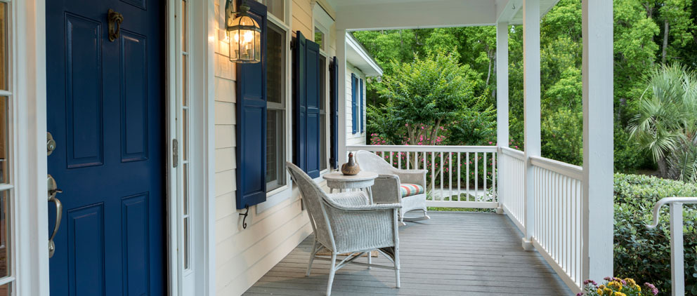 Cozy front porch with two deck chairs