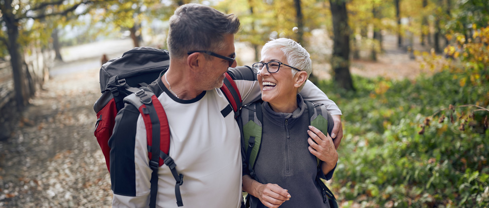 Senior couple hiking on a trail