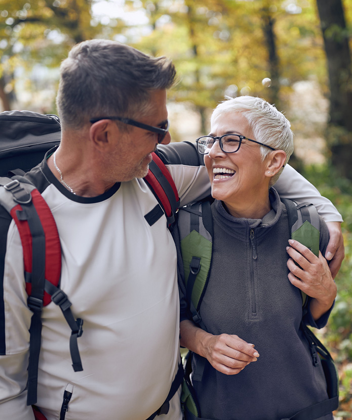 Senior couple hiking on a trail