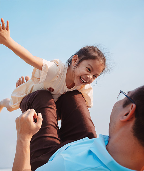 A father playing with his daughter