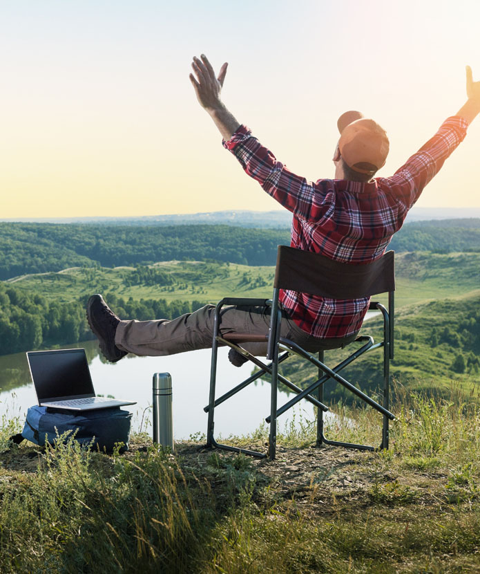 Man on top of a mountain proving that he can bank from anywhere