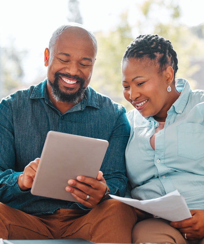 Couple using ServU's website to pay their loans online