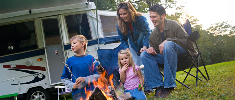 Family enjoying a day out with their camper