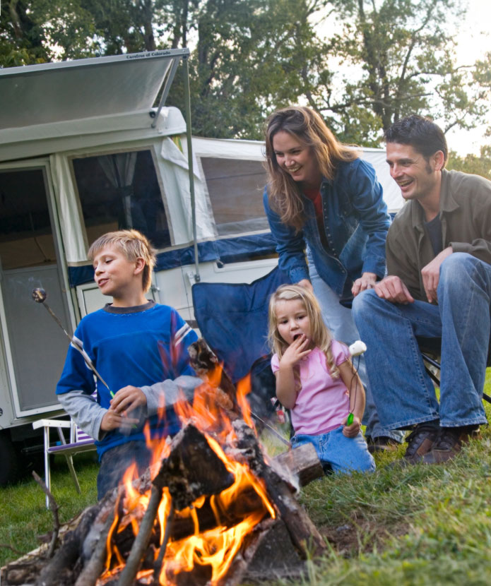 Family enjoying a day out with their camper