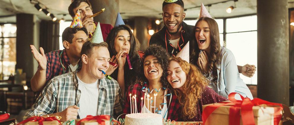 Group of people gathered for a birthday party